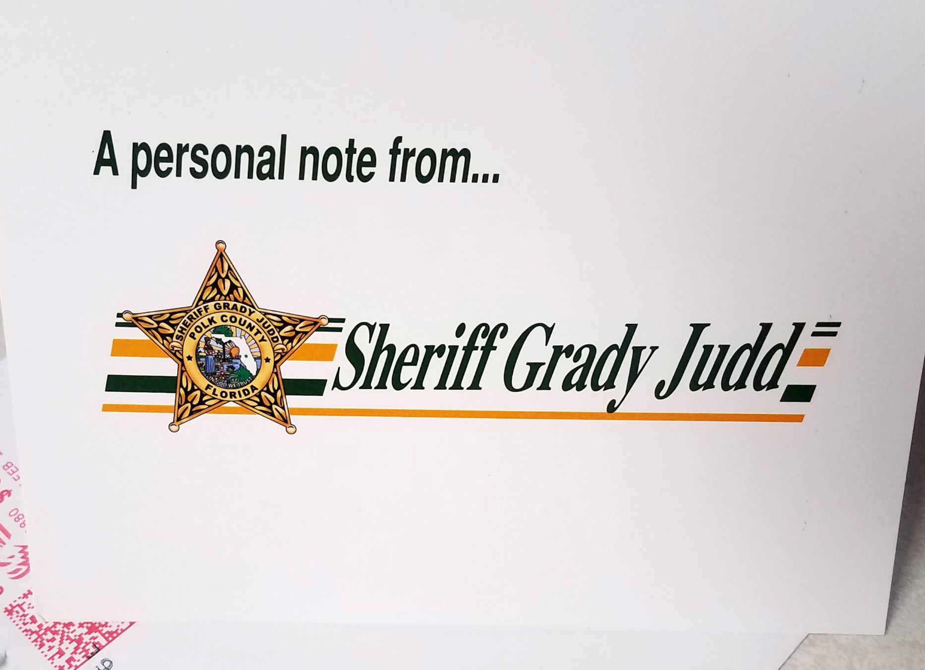 Kris Courtney promotional card with 'Wake Up, Earl!' featured in Sheriff Grady Judd's Morning Coffee endorsement